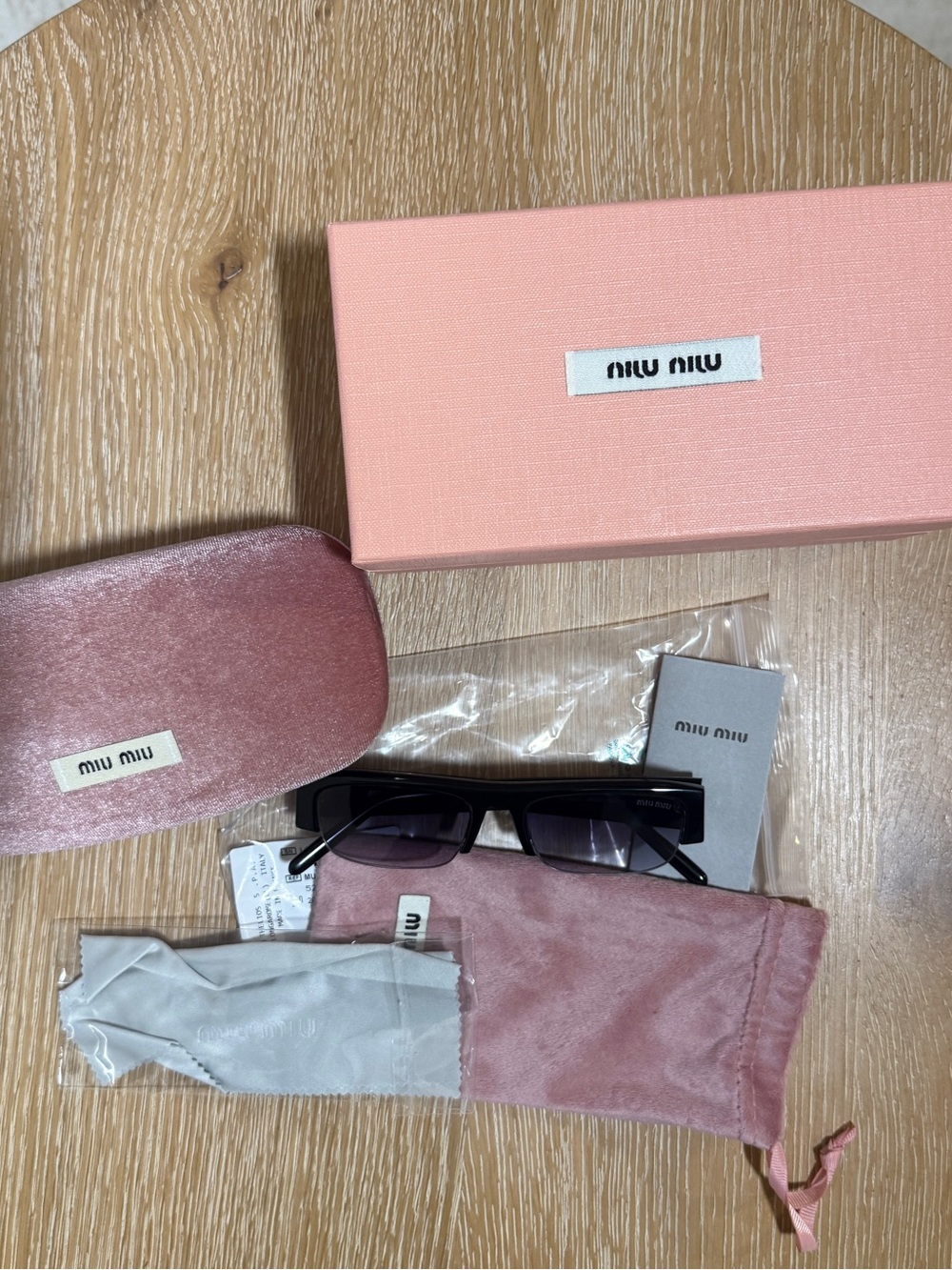 Miu Miu Black Rectangular Sunglasses with Pink Accessories